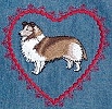 Close up of embroidery on denim apron